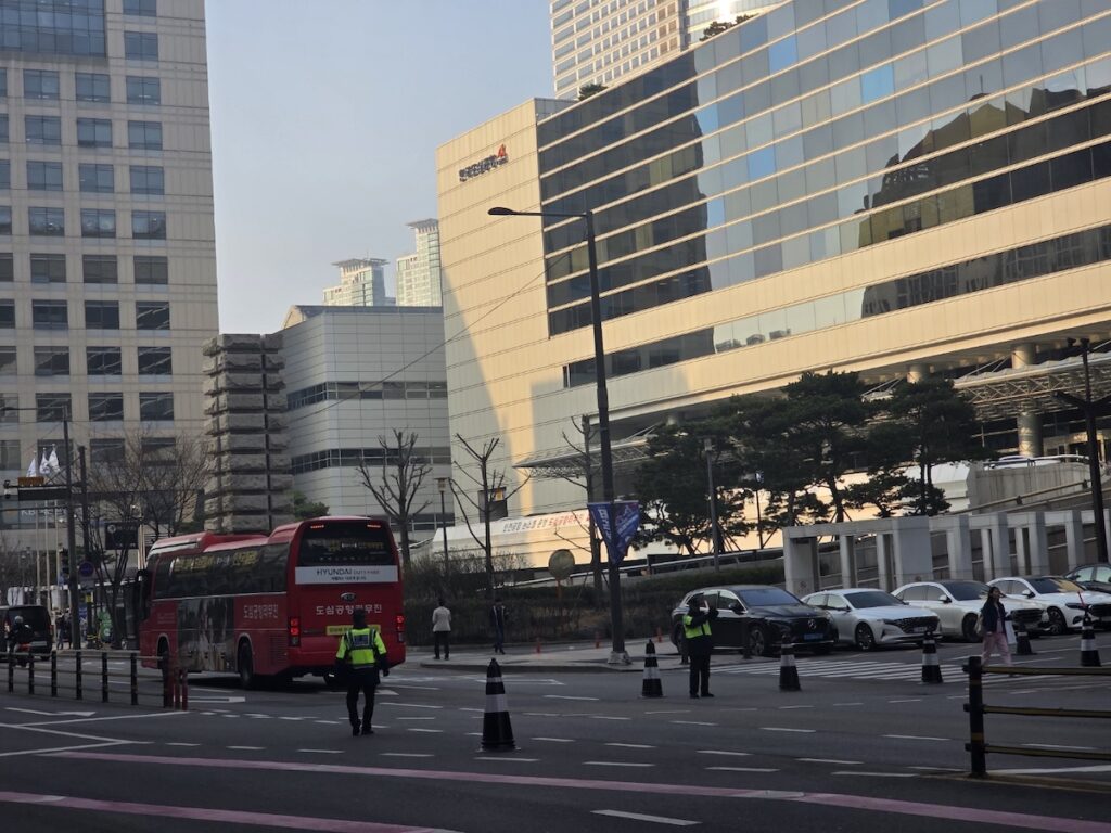 6103-limousine-bus-gangnam-to-incheon-airport-road A red 6103 Limousine Bus departing from the Korea City Air Terminal CALT in the heart of Gangnam.
