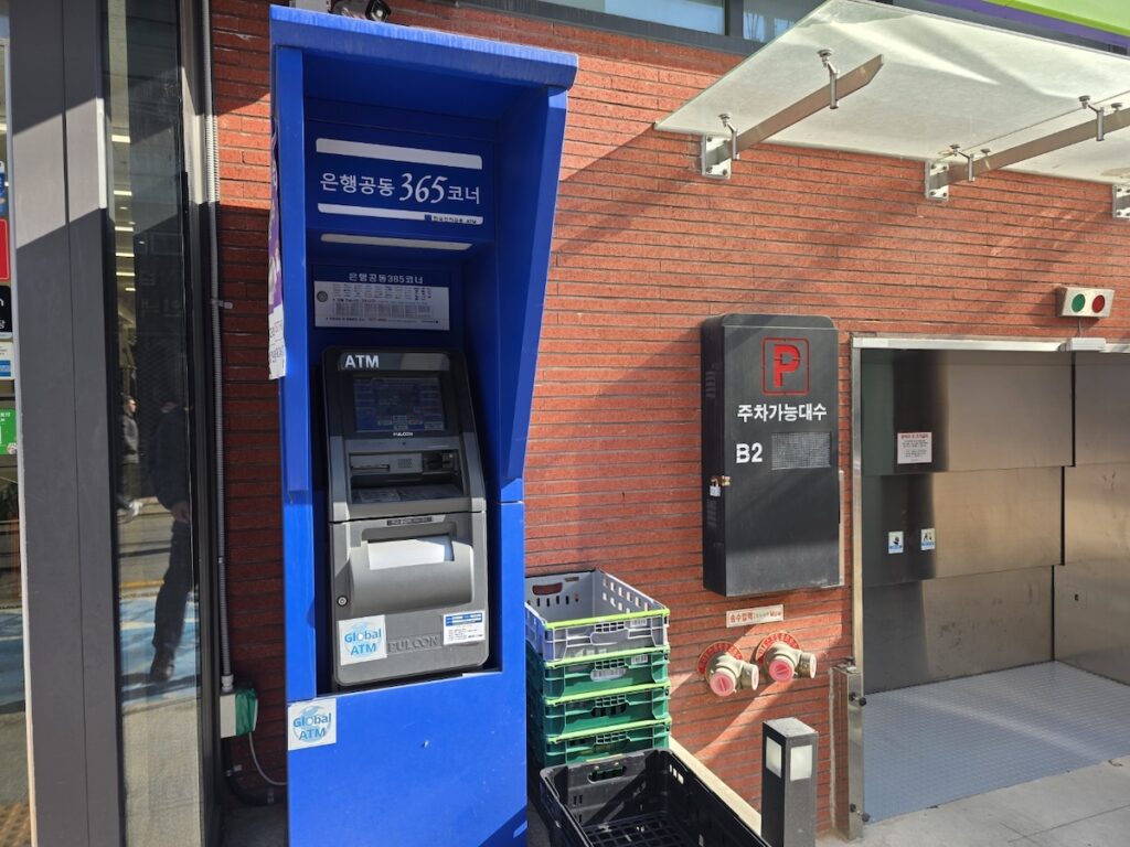 A Global ATM in Korea located outside a convenience store available 24/7