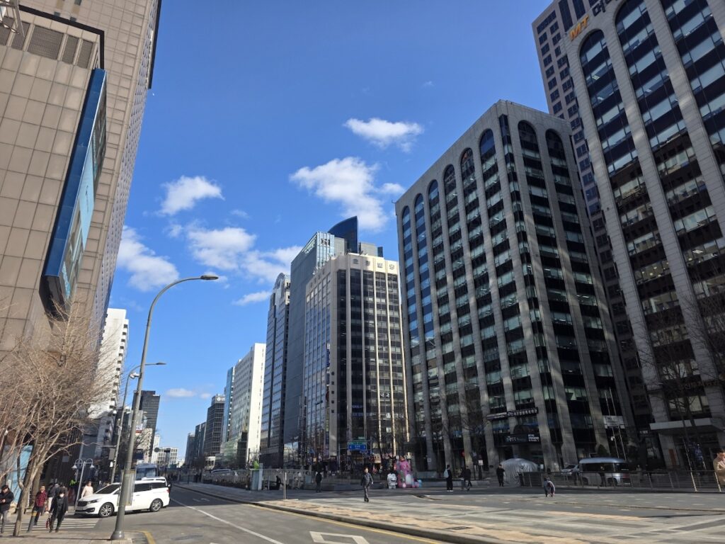 The skyline of Seoul near the venue for the **BTS Gwanghwamun Comeback 2026**.