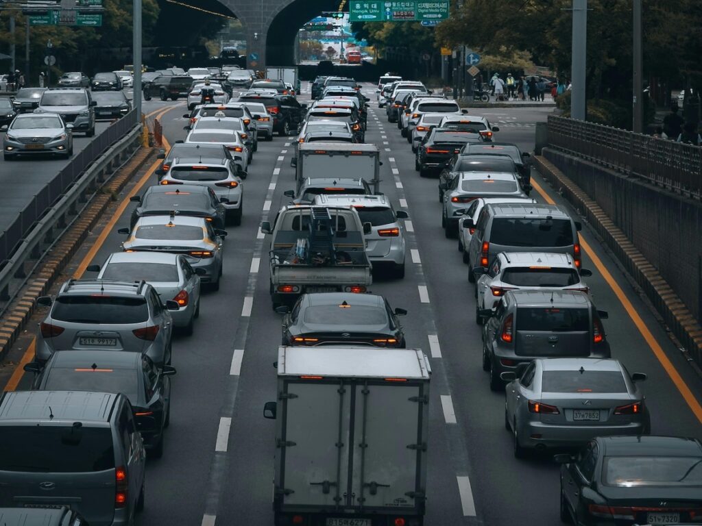 A high-angle shot of heavy traffic congestion on Seoul's major expressway, illustrating the challenges of Driving in Seoul for Foreigners in 2026.