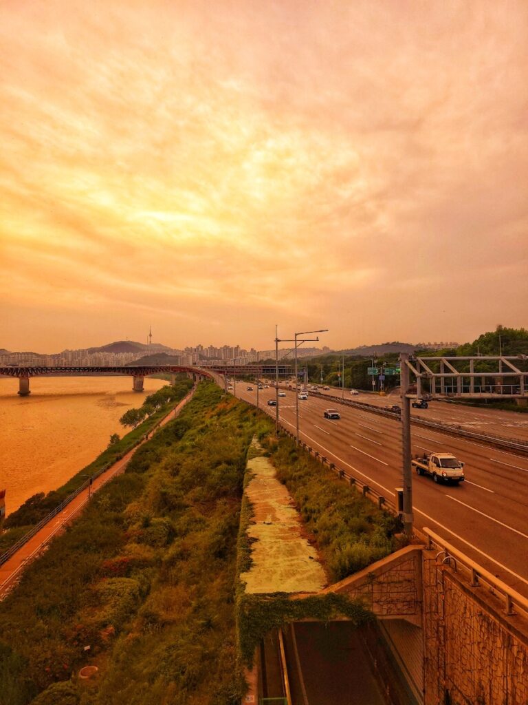 “Gangbyeon-daero highway in Seoul with busy traffic along the Han River”