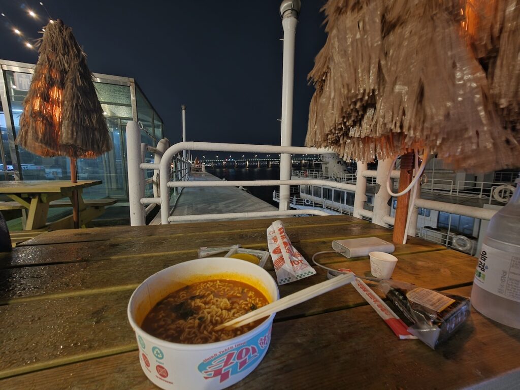 Han River ramyeon on a floating rooftop near Jamwon Hangang Park at night