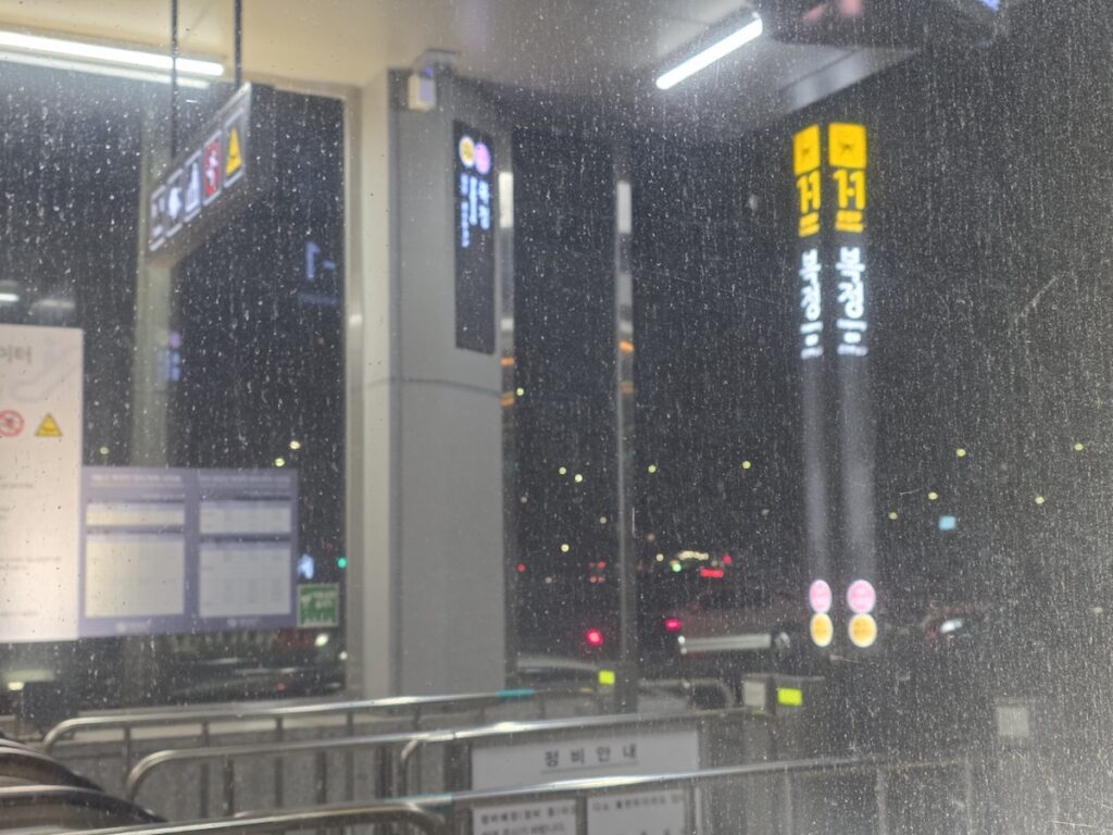 how to get around Seoul using subway stations and public transport signs at night