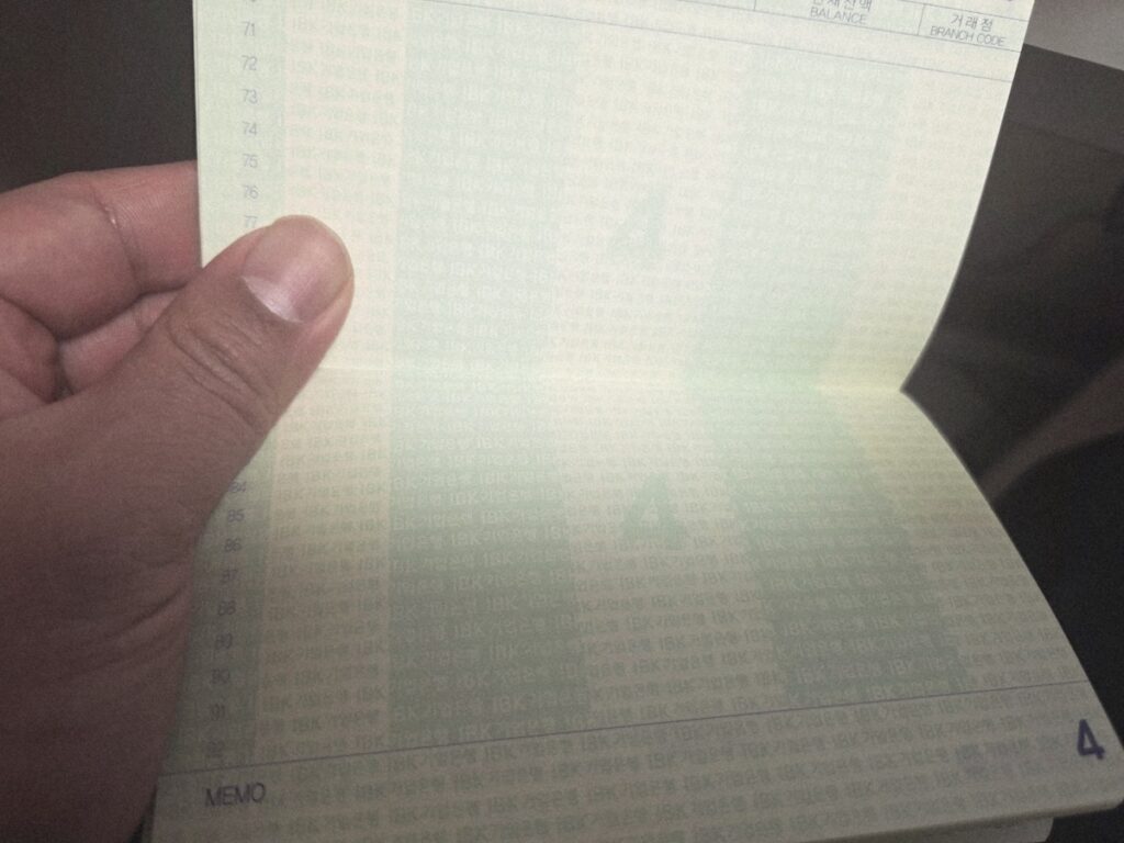 Korea Banking: The physical bankbook ritual required for traditional Korean banking.