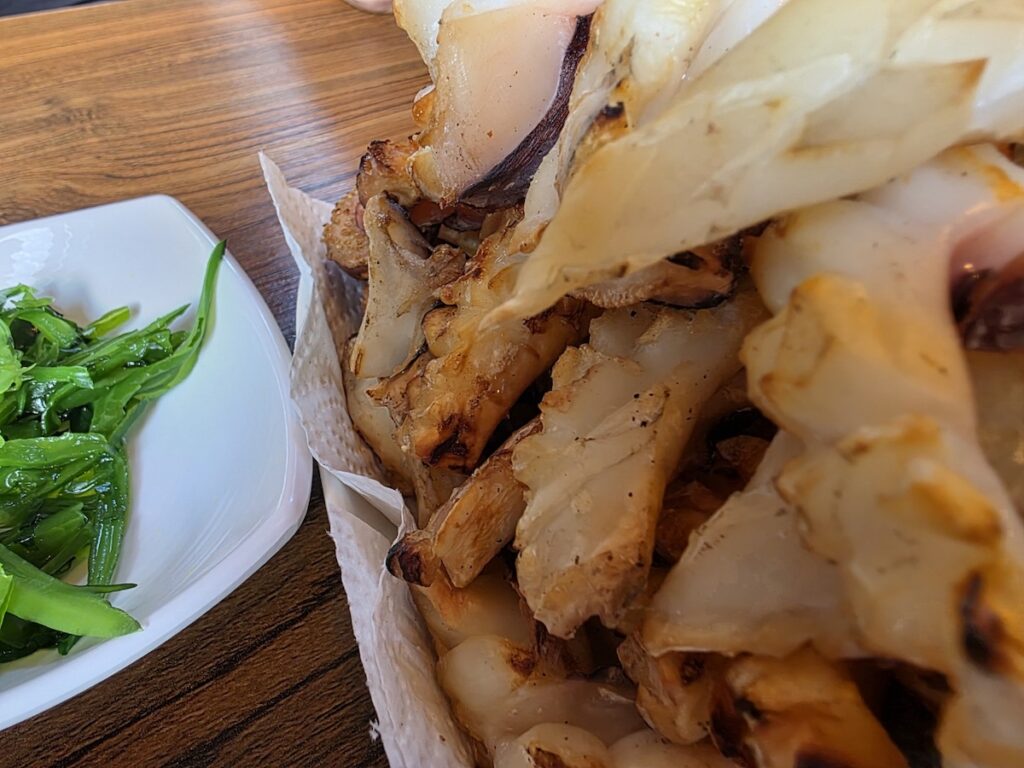 korean-dried-squid-with-mayo-sauce Close-up of grilled Korean dried squid with mayonnaise and soy sauce dip for beer pairing”
