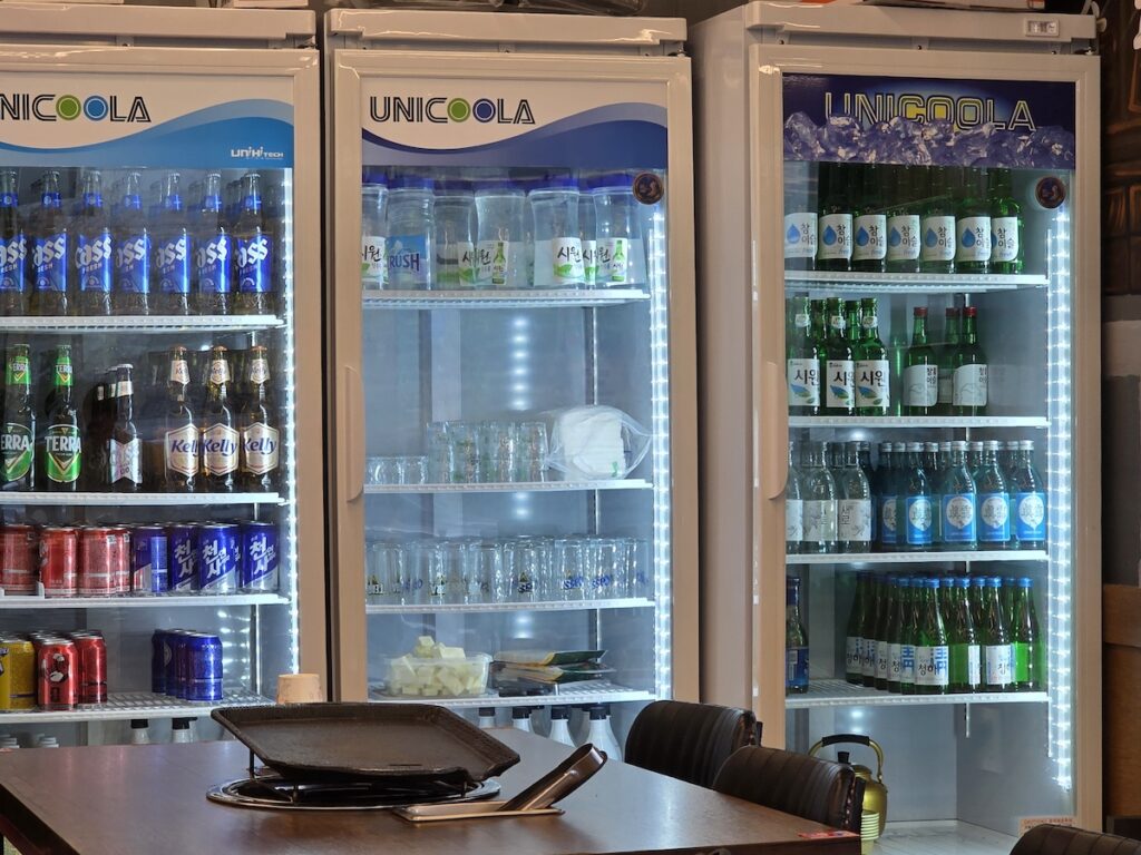 korean-drinking-culture-soju-beer-fridge Restaurant fridge filled with soju and beer bottles in Korea