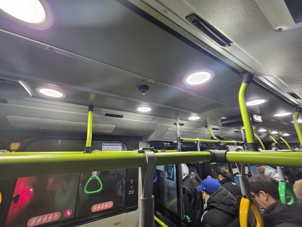 Passengers riding a late-night bus in Seoul, a great alternative when looking for the Seoul subway and bus last call options after midnight.
