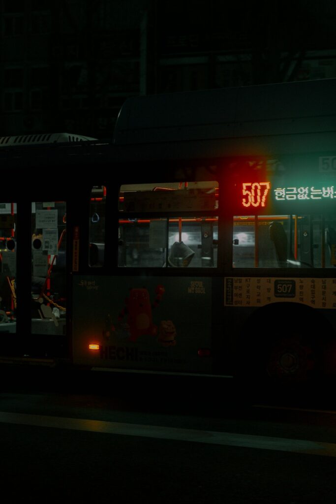 “Passenger tapping a transit card on the bus exit reader in Seoul.”