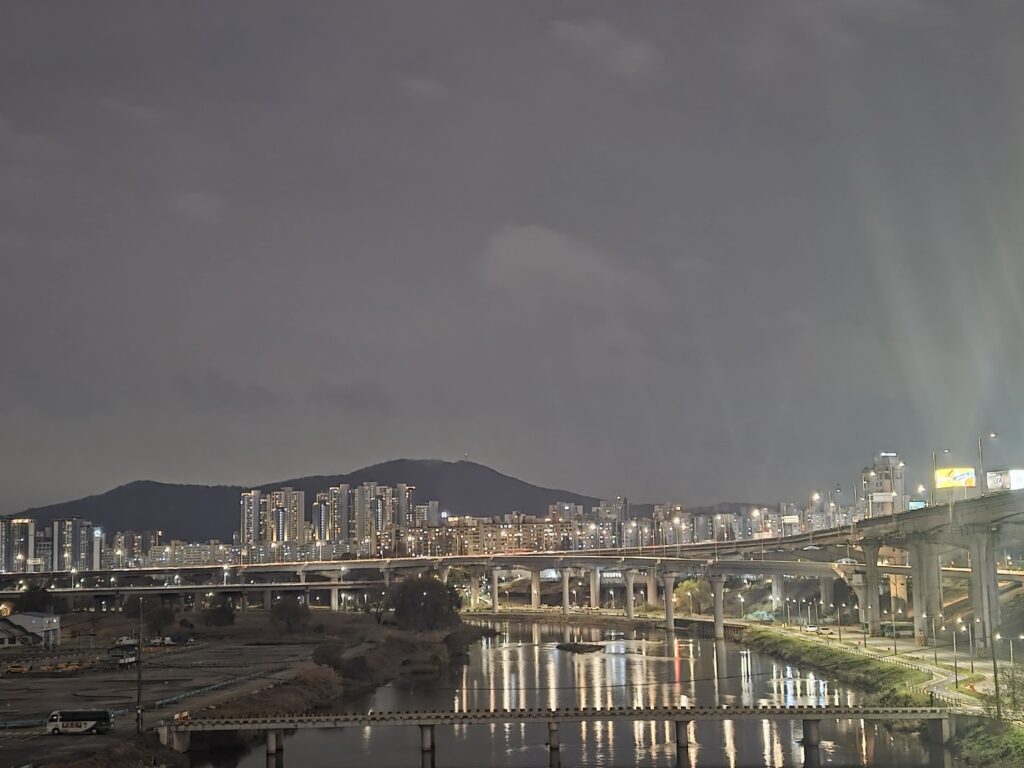 A nighttime view near Samseong Station with bright city lights and the modern atmosphere of Gangnam.