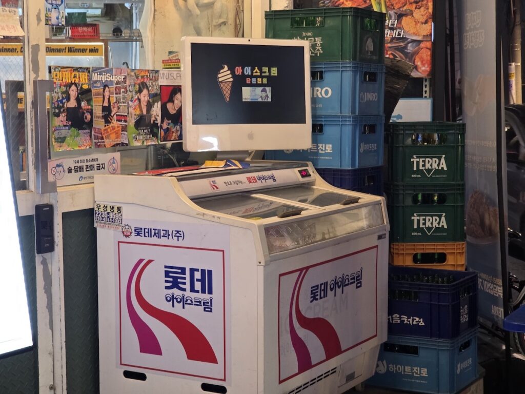 The entrance of a local retro pub in Konkuk, showing the neon signs and traditional 'pocha' aesthetic of Seoul East Guide 2026.