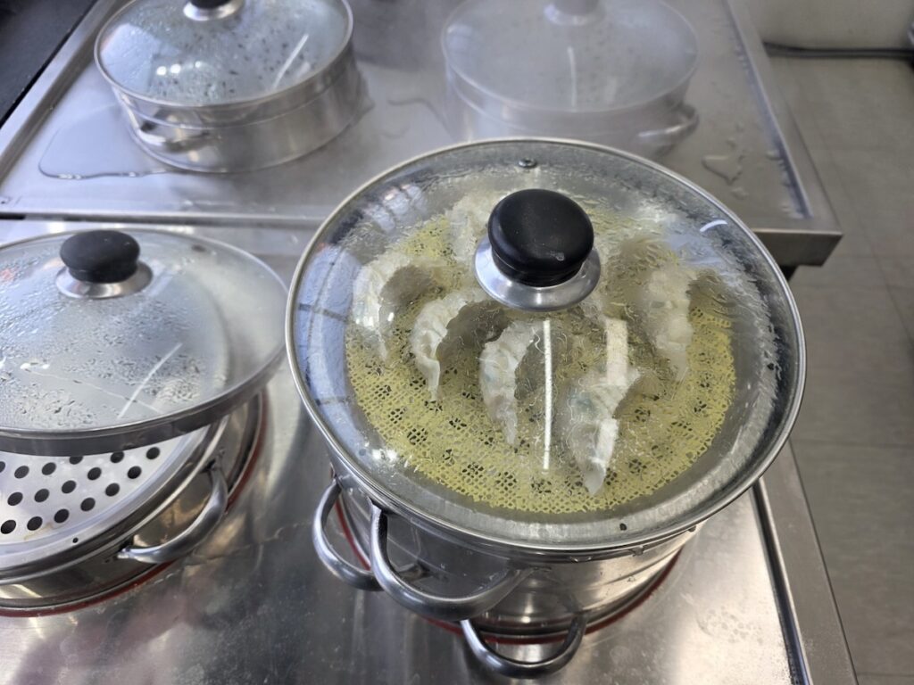 seoul-mandu-protocol-steamer-ritual-jamsil "Cinematic steam rising from metal tiers at a neighborhood shop, a key visual of the Seoul mandu protocol in Jamsil."