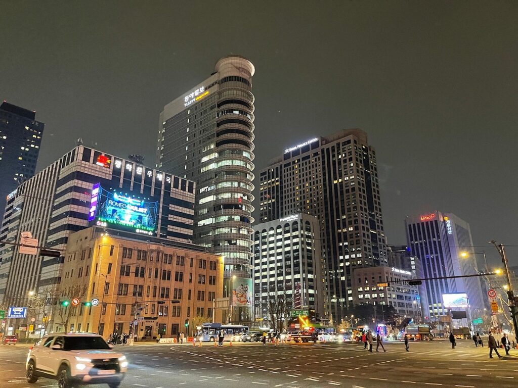 Night view of Gwanghwamun, Seoul, showcasing the complex urban infrastructure that requires real-time data updates in Korea.
